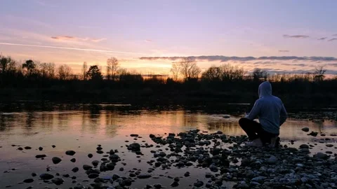 River photographer at sunset Stock Footage 269772941