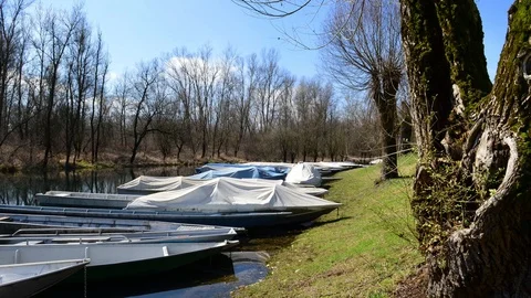 River with pier and typical boats moved by the current Stock Footage 87340645