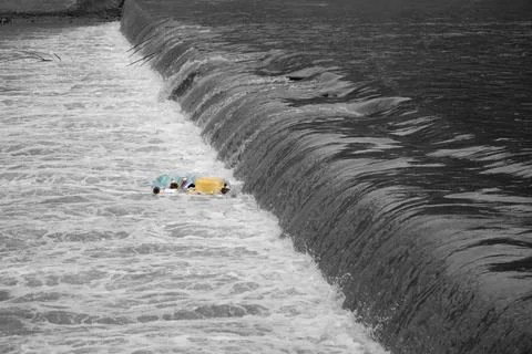River   polluted with plastic waste. Stock Photos
