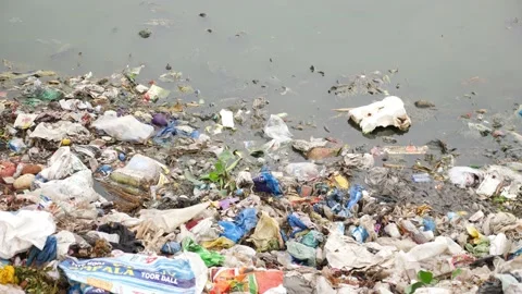 River that is polluted with various garbage and trash Stock Footage 140248086