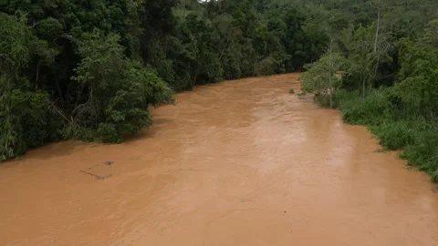 River pollution after soil erosion, Malaysia Stock Footage 311771635