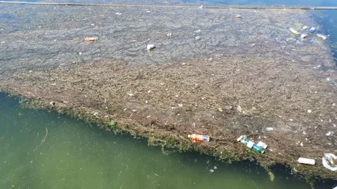 River pollution with garbage discharge Stock Footage 138982963