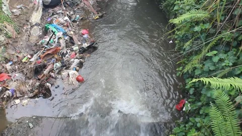 River Pollution: Garbage in Flowing Waters Stock Footage 277059473