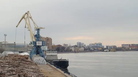 River port, Crane loads sand onto the ship Stock Footage 149321829