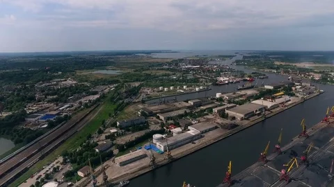 River Port. Ships Staying in Docks. Storage Buildings on Shore. Concrete Stock Footage 73859699