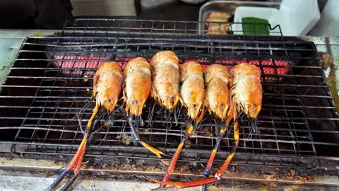 River Prawns Grilling Over Charcoal at Thailand Night Market Stock Footage 336785023