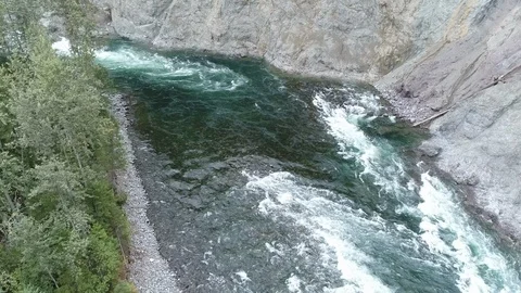River Rapids Along Rock Wall Stock-Footage 120844657