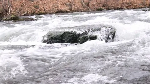 River rapids flow over large boulder. Winnipesaukee River. Stock Footage 91896245