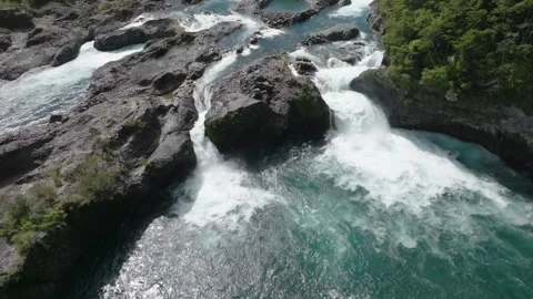 River Rapids Through Forest and Volcanic Rocks in Chile Petrohue Waterfalls Stock Footage 310614076