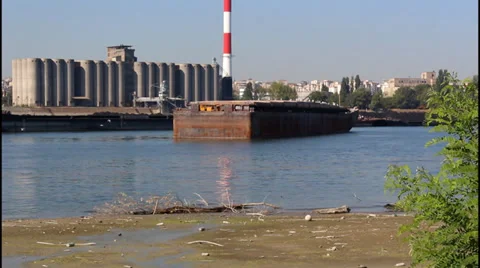 River, red chimney, tilt up Video stock 32265947