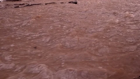 The river is red. The concept of contamination of running water with iron oxide Stock Footage 152619304