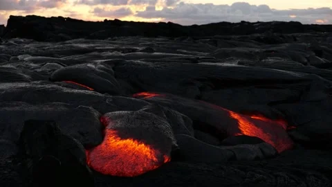A river of red-hot lava from an exploding volcano Video stock 219855564