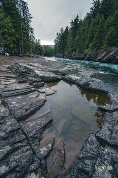 River reflected in a calm pool Stock Photos