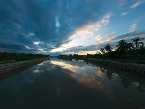 River Reflecting Dramatic Sunset Sky 스톡 사진