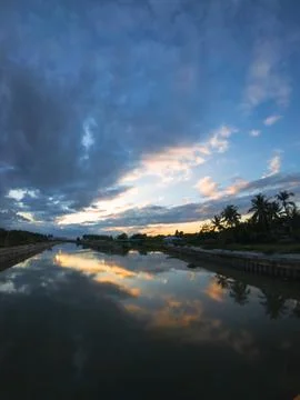River Reflecting Sunset Clouds Stock Photos