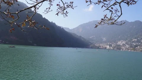 River Reflections Beneath Towering Peaks Stock Footage 337626051