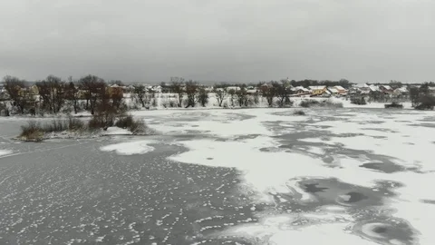 River road to the village in winter in a cloudy day Stock Footage 120146183