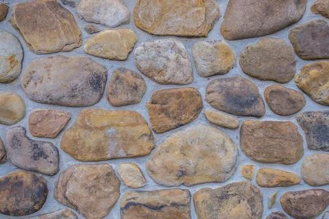 River rock wall closeup Stock Photos