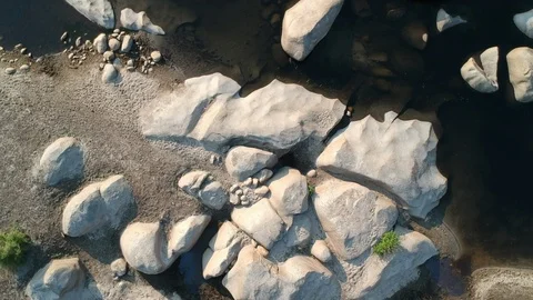 River with rocks - drone shot turning around Stock Footage 107880503