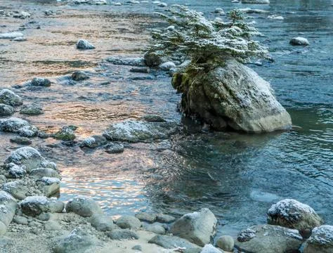 River rocks at sunset Stock Photos