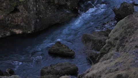 A river with a rocky bed and a small waterfall Stock Footage 301792468