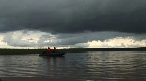 River, rowing boat, dark grey sky Stock Footage 68945123