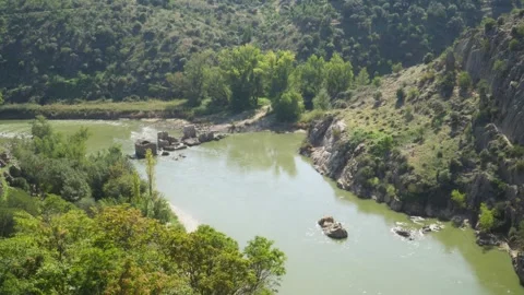 River with the ruins of a bridge in spain Stock Footage 314858623