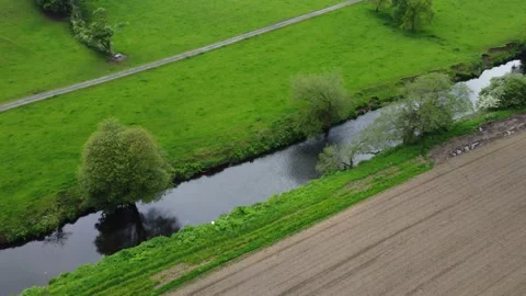 River Running Through Fields Stock Footage 155404141