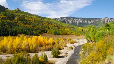 River running through the mountain valley in Colorado during the fall Stock Footage 55531440