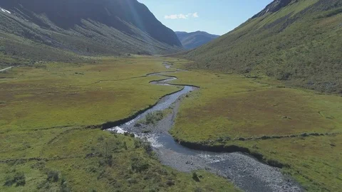 River running through valley aerial view Stock Footage 79659556