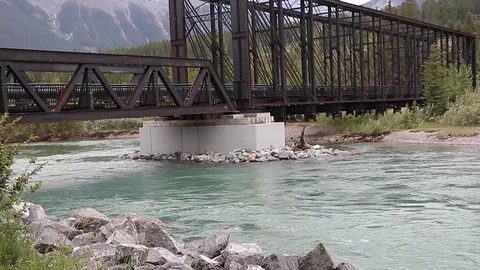 River running under foot bridge Stock Footage 112365840