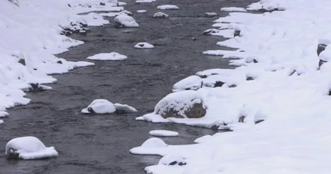The River Runs Calmly While the Snow Melts 스톡 동영상 239978012