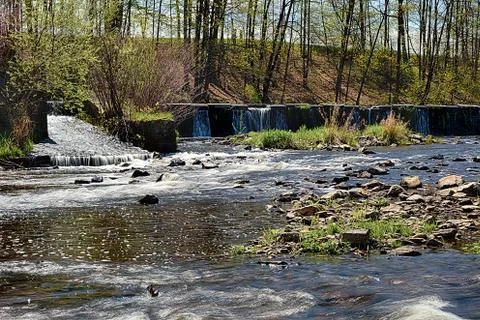 River runs over boulders Stock Photos