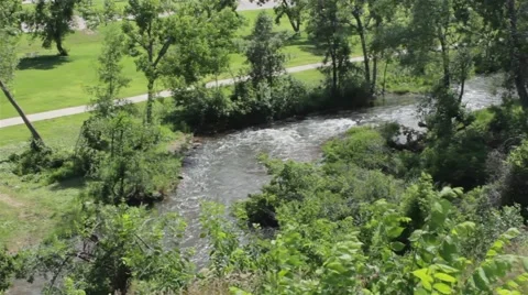 River Runs Through Grassy Park Stock Footage 47745289