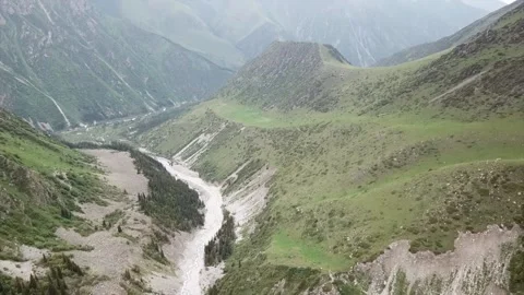 The river runs through a green gorge in mountains. 스톡 동영상 148231908