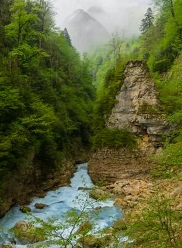 River rushing in a deep mountain canyon, outdoor travel background Stock Photos