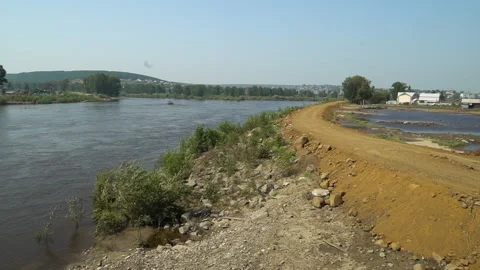 A river in the Russian outback. Temporary dam after the flood. Summer, sunny day Stock Footage 155901175