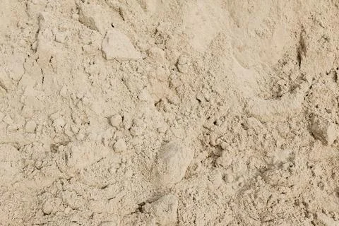 River sand close-up as a background on a construction site Stock Photos