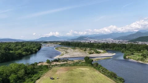 River Sandbar and Mountain Landscape in Nagano Japan Stock Footage 336616974