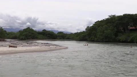River with a sandy beach going deep into the tropical jungle. Stock Footage 159725337