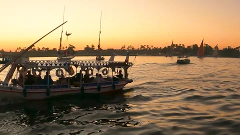 River scape of Tourists sitting on egyption Local felucca tour boats on Vidéo 240384651