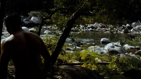 River Scene with Man’s Shadow Walking Stock Footage 321320960