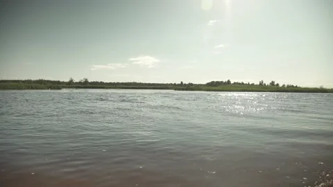 River scene with meadows in the opposite side in a windy sunny day Stock-Footage 161153072