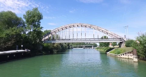 River seen from the sky and fly under a bridge Stock Footage 85857332