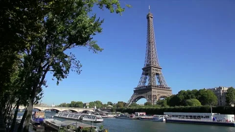 River Seine and Eiffel Tower with tourists sightseeing on boat excursions. Paris Stock Footage 237096633