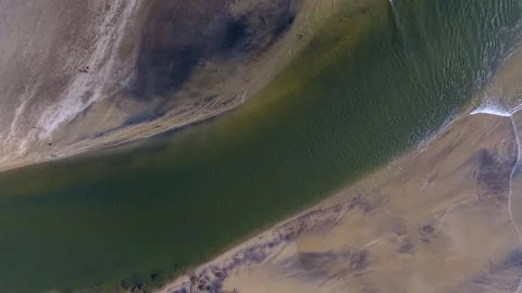 River separates Aare from ware beach near Ratnagiri, Maharashtra, India Stock Footage 320600388