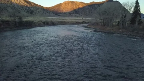 River in shadow with golden peaks Stock-Footage 166533770