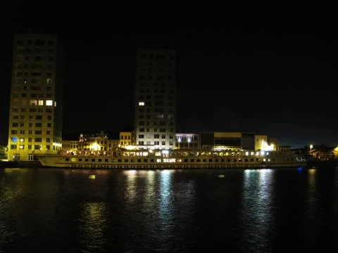 River ship on dock at night Stock Photos