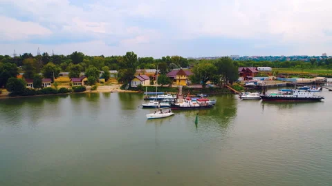 On the river, ships are moored to a small village pier, Russia Stock Footage 119510859
