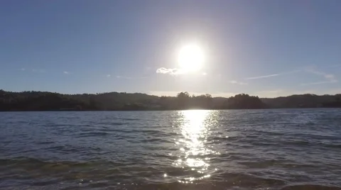 River shore waves at sunset steady shot 4k Stock Footage 67997564